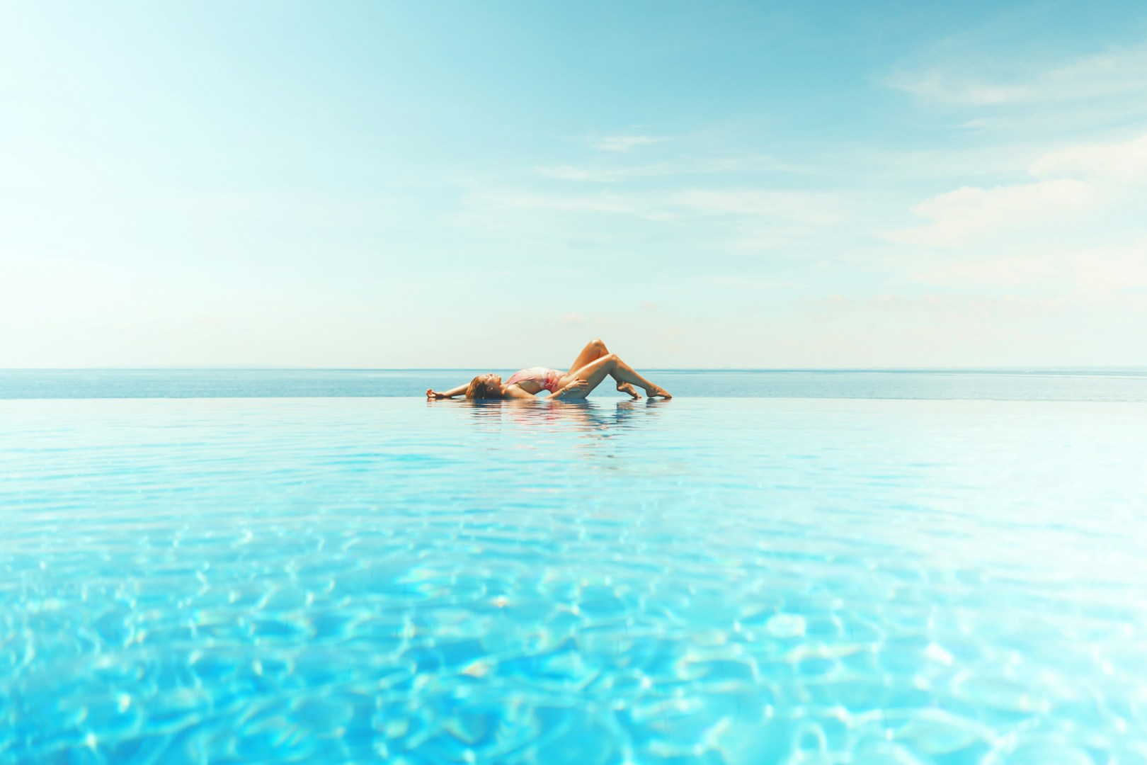 woman sun bathing on beach